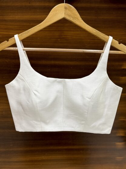 White princess-cut blouse with deep scoop neckline front and back