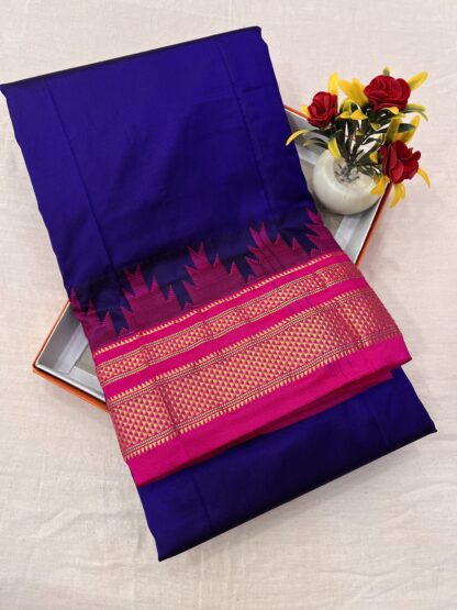 Elegant royal blue and pink silk saree with golden zari work – perfect for weddings and festive occasions.