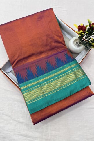 Traditional burnt orange and teal green Ilkal saree with silk warp, cotton weft, and a gold zari temple border.