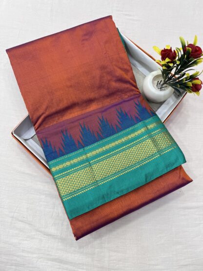 Traditional burnt orange and teal green Ilkal saree with silk warp, cotton weft, and a gold zari temple border.