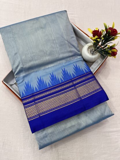 Traditional Ilkal saree in sky blue and royal blue with intricate golden zari border.