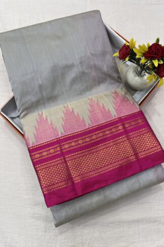 Elegant grey and pink Ilkal saree with a traditional Chikki Paras border, featuring a silk warp and cotton weft.