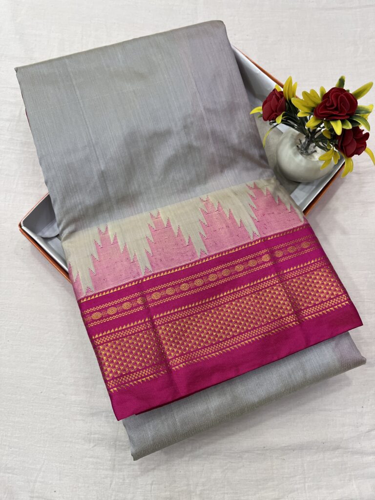 Elegant grey and pink Ilkal saree with a traditional Chikki Paras border, featuring a silk warp and cotton weft.