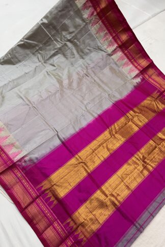 Full view of a grey and pink Ilkal saree with a luxurious golden pallu, crafted with silk and cotton weaving.