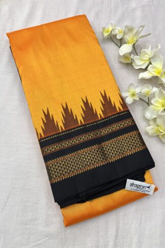 Pure silk saree in vibrant sunset orange and midnight black with intricate golden zari detailing and temple-inspired motifs.